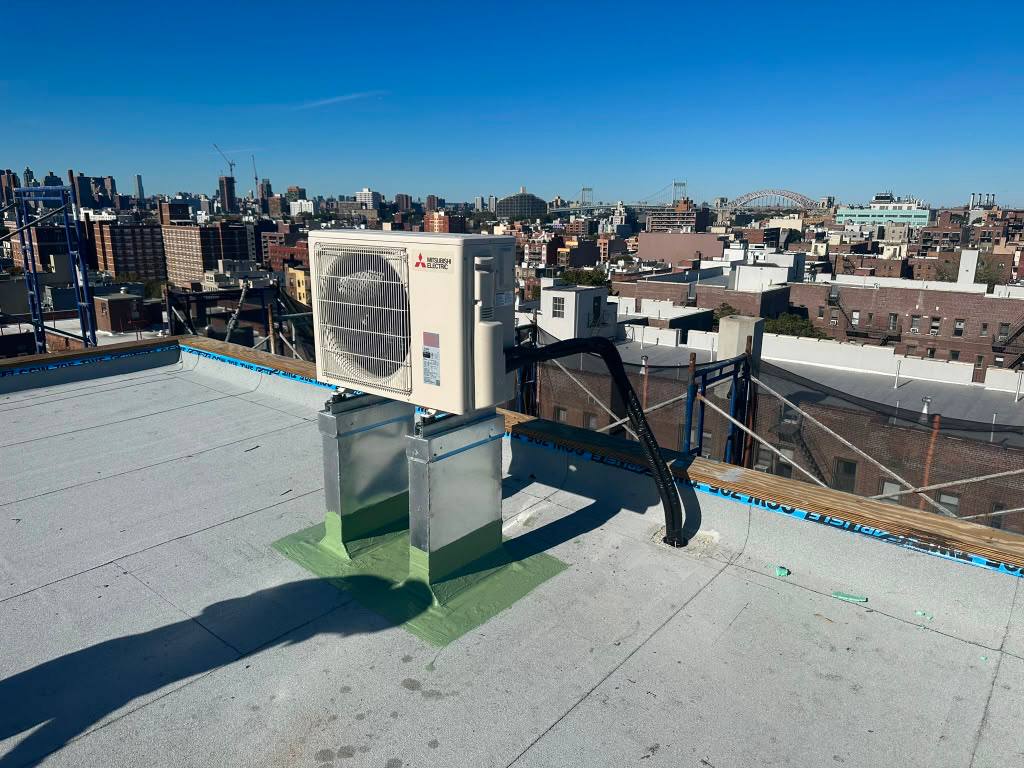 Outdoor Mitsubishi Electric unit mounted on a rooftop